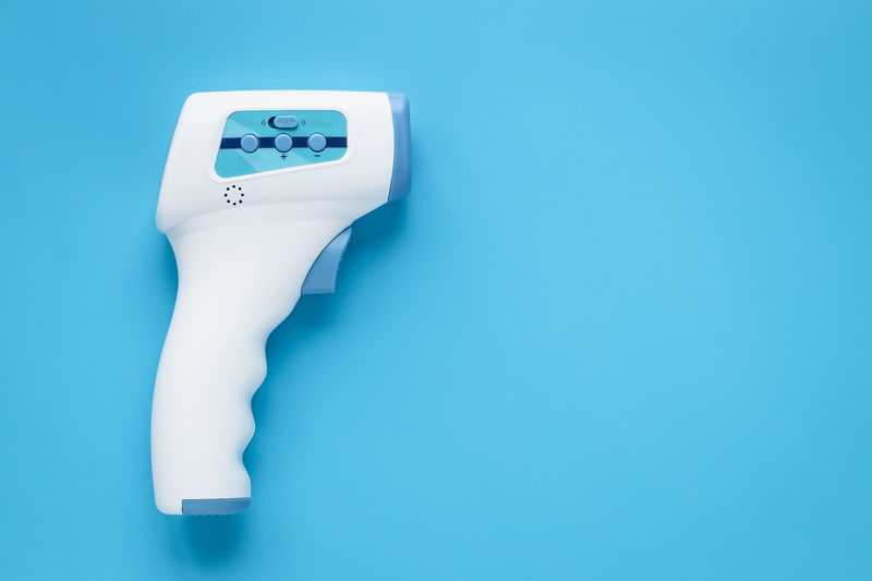 Digital medical infrared forehead thermometer gun non contact for measuring temperature, for COVID-19 testing. 